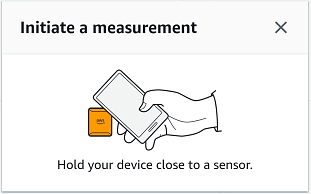 Smartphone screen showing "Ready to Scan" with an icon of a phone near a sensor.