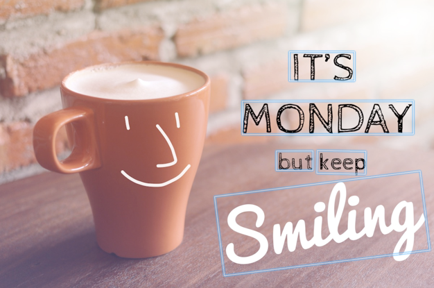 Taza de café con carita sonriente y texto «It's Monday but keep smile», con recuadros delimitadores y texto extraído.