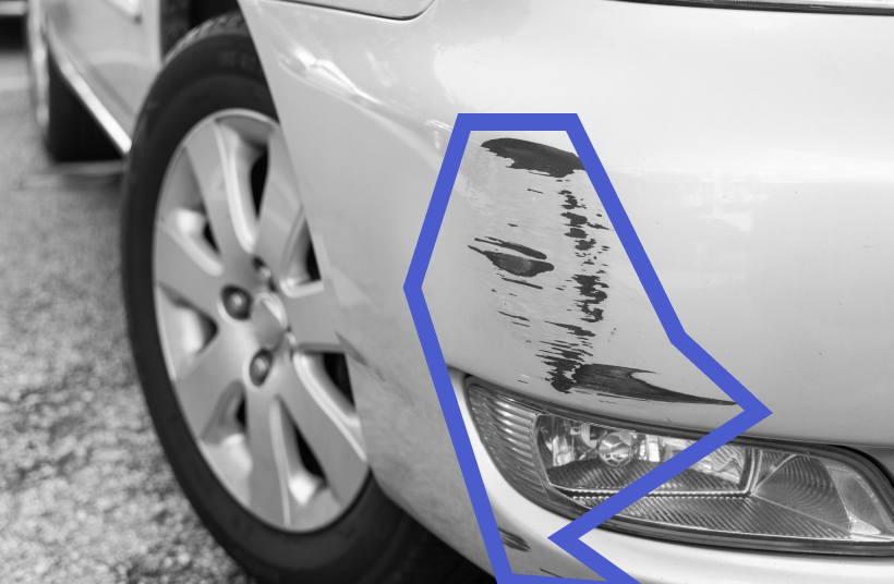 Car panel with visible damage and scratches near the headlight, highlighted by blue outline.