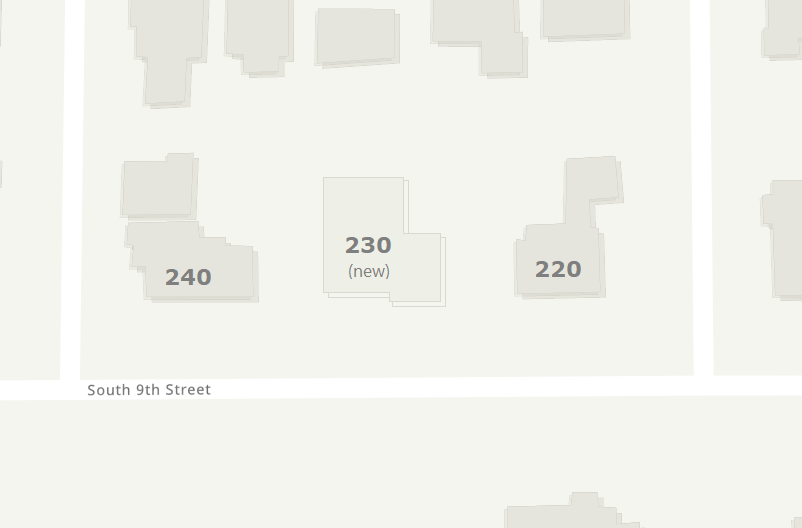 A map of a single block with two existing houses, and one new house added between them.