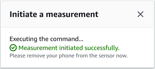 Dialog box showing successful measurement initiation and instruction to remove phone.