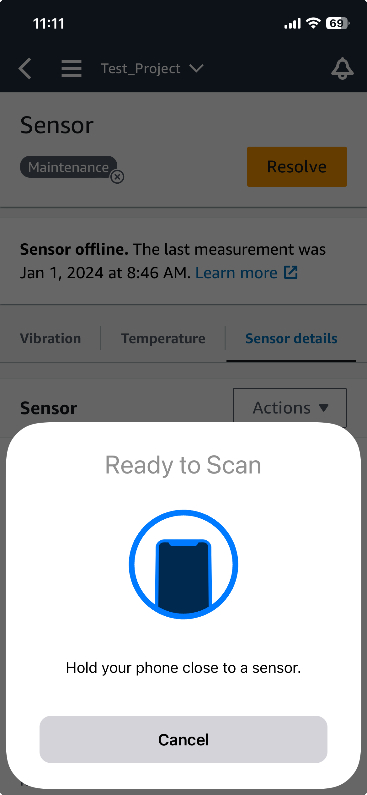 Smartphone screen showing "Ready to Scan" with an icon of a phone near a sensor.