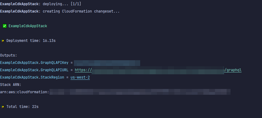 Deployment output showing ExampleCdkAppStack details, including GraphQL API URL and stack region.