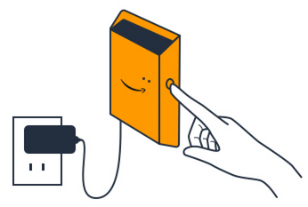 Hand pointing to smiling orange device connected to power outlet, indicating activation.