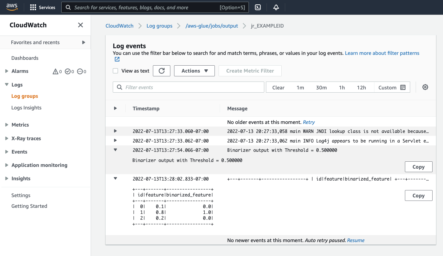 Spark プログラムの出力を含む CloudWatch コンソールページ。