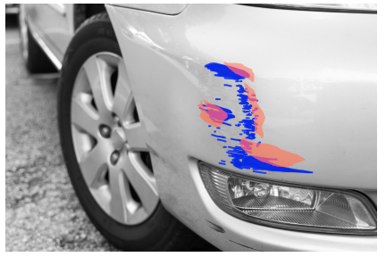 Close-up of a car's front bumper with blue and pink paint marks, indicating damage.