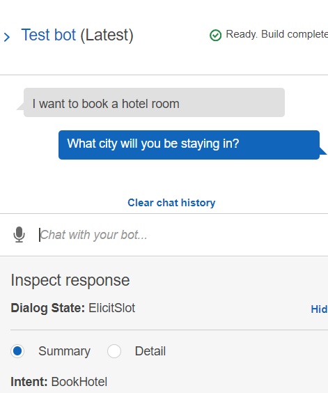 Chat interface showing a hotel booking conversation with a bot asking for the city.